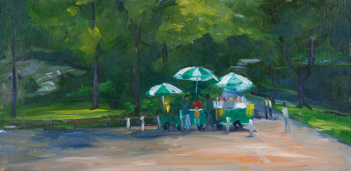 A stack of antique books on a decorative mantle, with other books in the background.